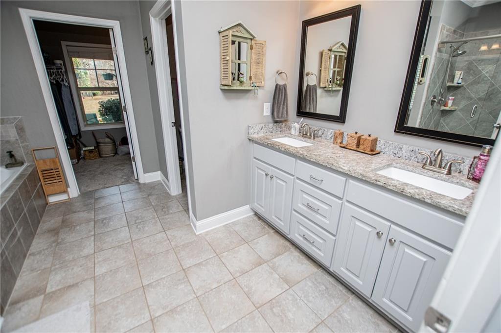 201 Overton Point Carrollton, GA 30116 - Photo 24 of 43 a bathroom with a sink a vanity and a mirror