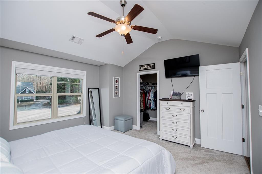 201 Overton Point Carrollton, GA 30116 - Photo 25 of 43 a bedroom with a bed and a flat screen tv