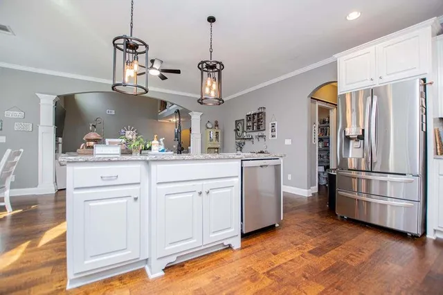 a bed room with a bed and a night stand