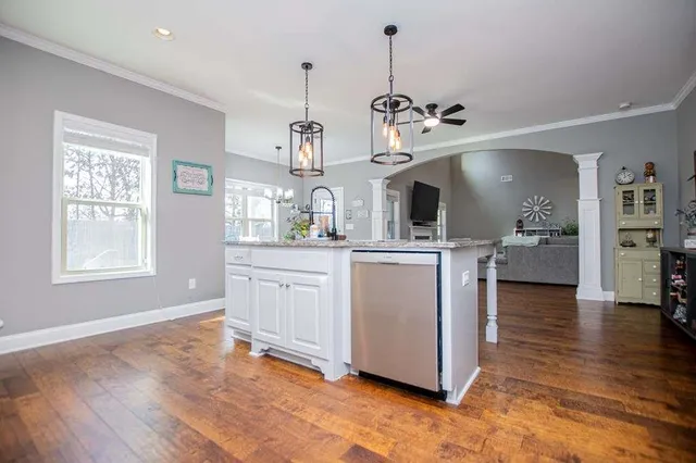 a view of a hallway view with wooden floor and staircase