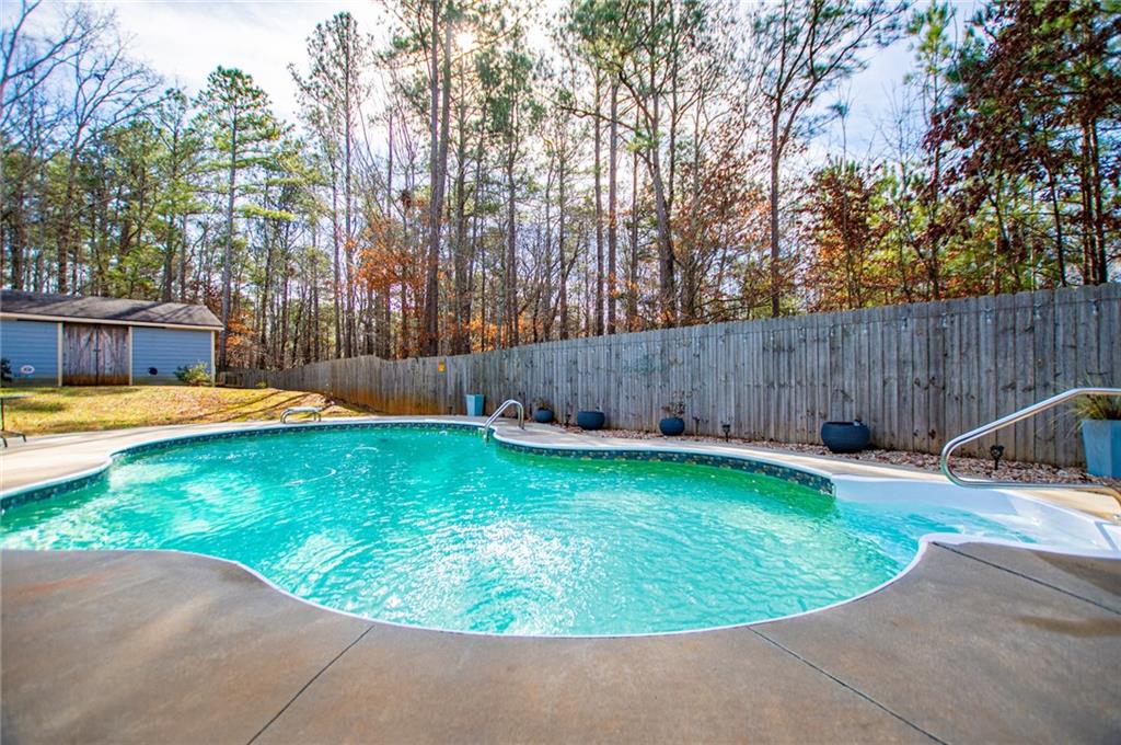 201 Overton Point Carrollton, GA 30116 - Photo 41 of 43 a view of a swimming pool with a patio