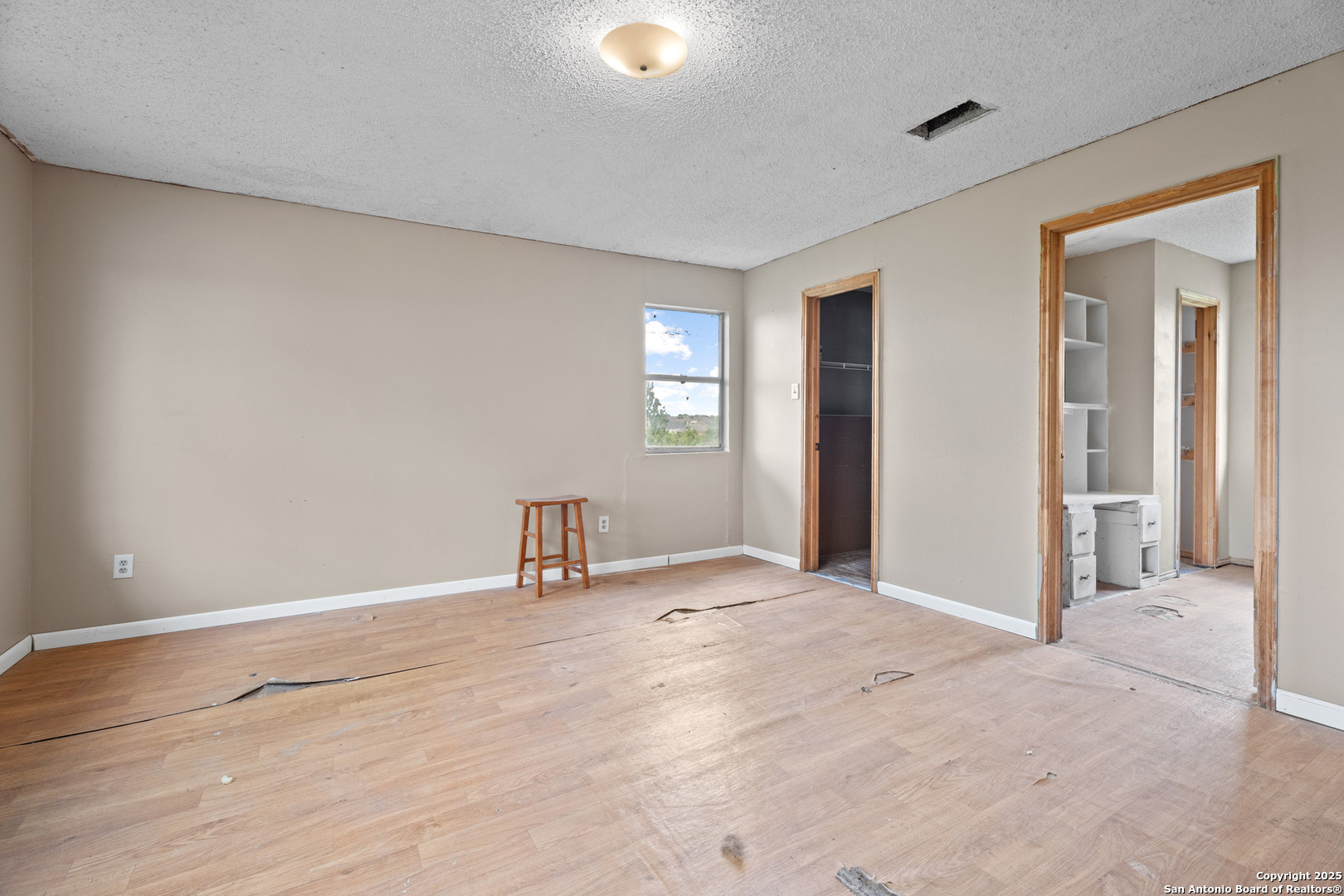 2862 Wetz Road Santa Clara, TX 78124 - Photo 16 of 37 a view of an empty room with window and wooden floor