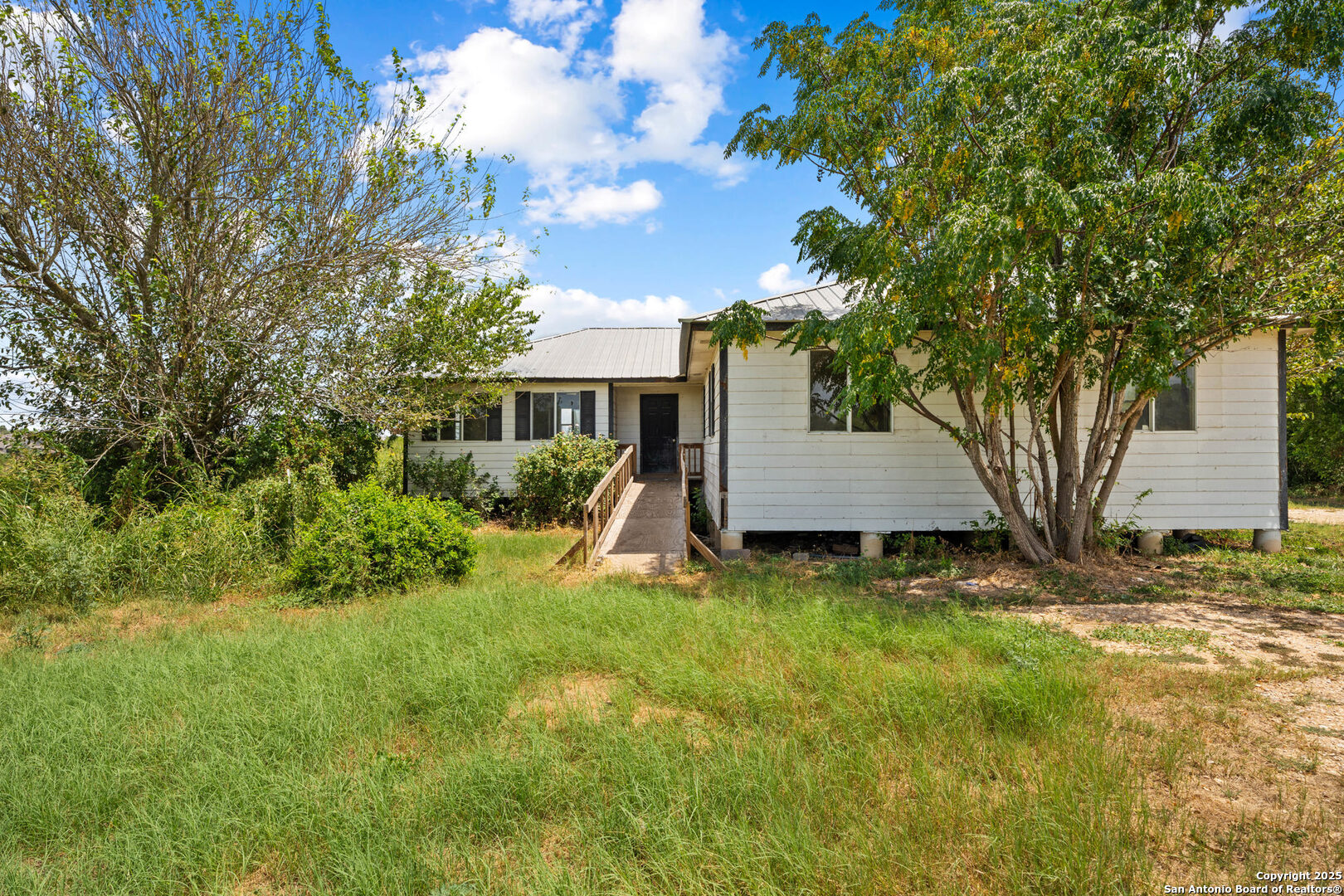 2862 Wetz Road Santa Clara, TX 78124 - Photo 3 of 37 a view of a house with a yard