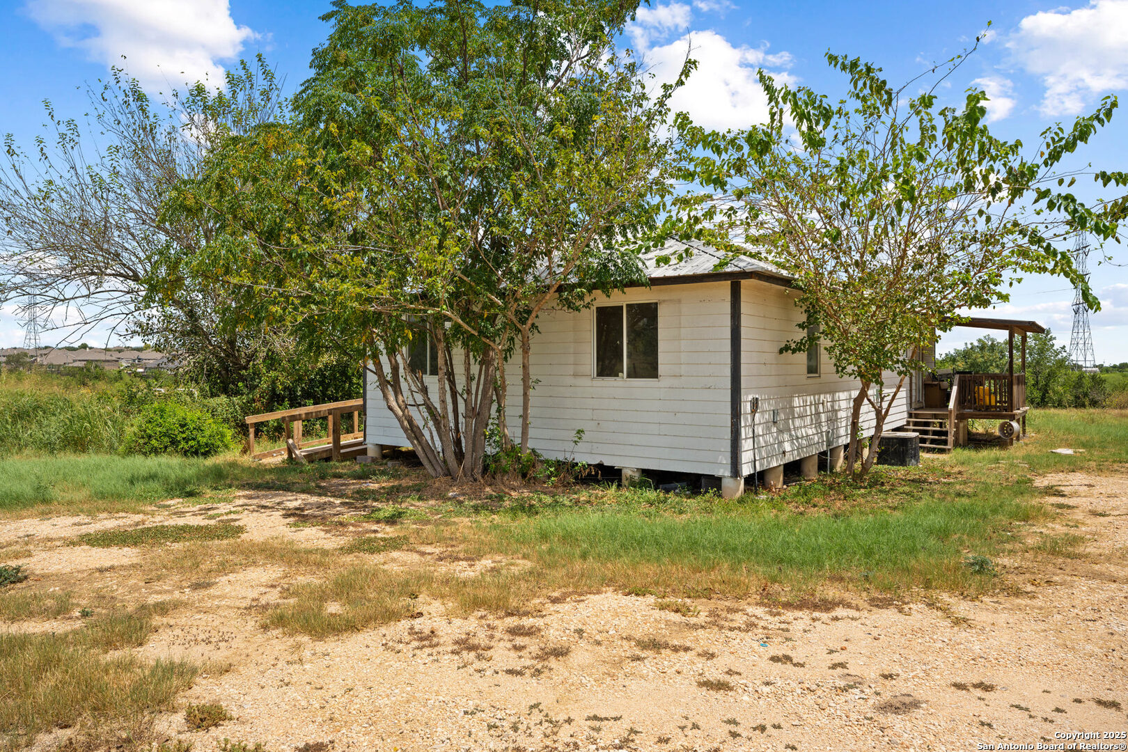 2862 Wetz Road Santa Clara, TX 78124 - Photo 4 of 37 a view of a backyard with a large tree