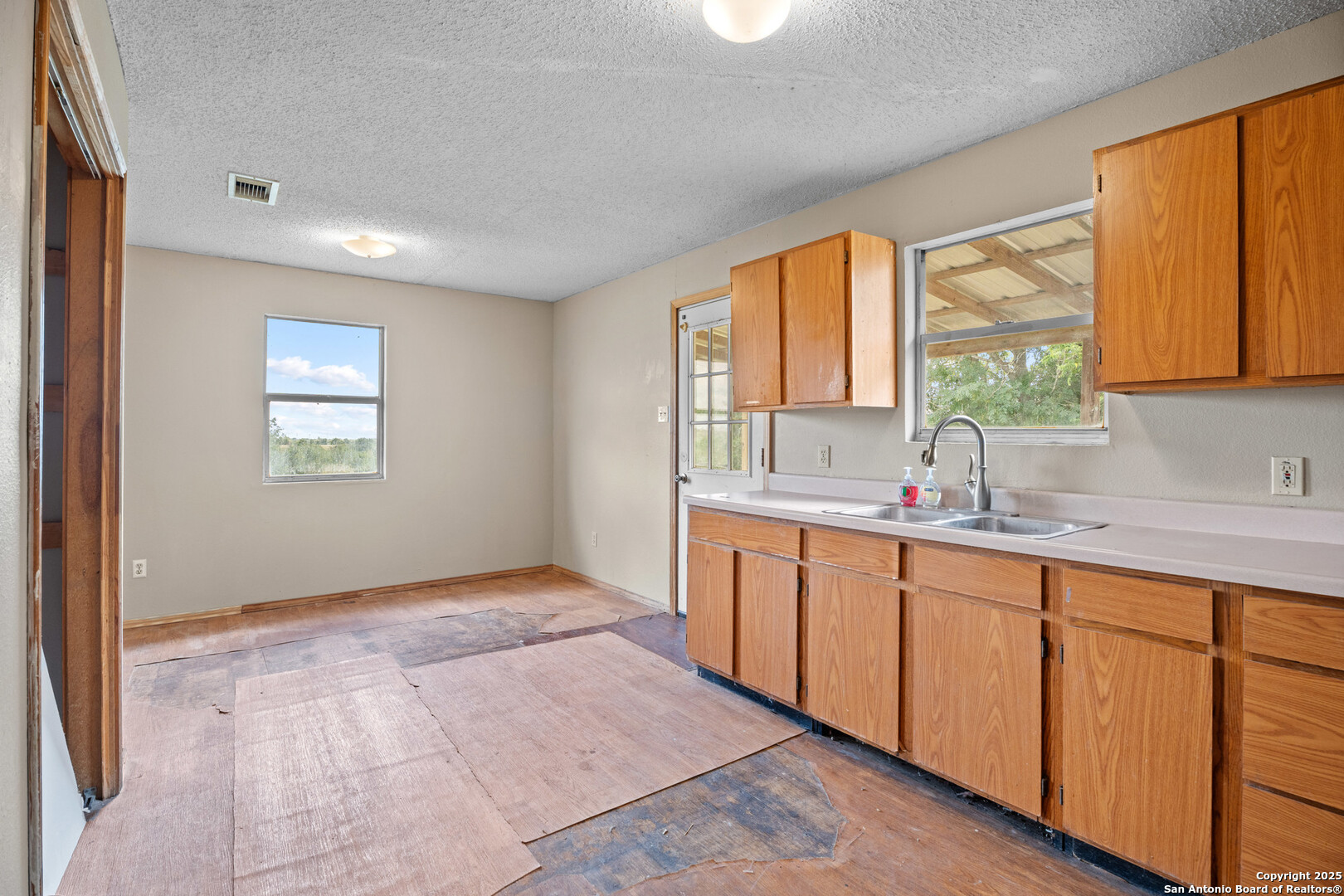 2862 Wetz Road Santa Clara, TX 78124 - Photo 10 of 37 a bathroom with a sink mirror and a window