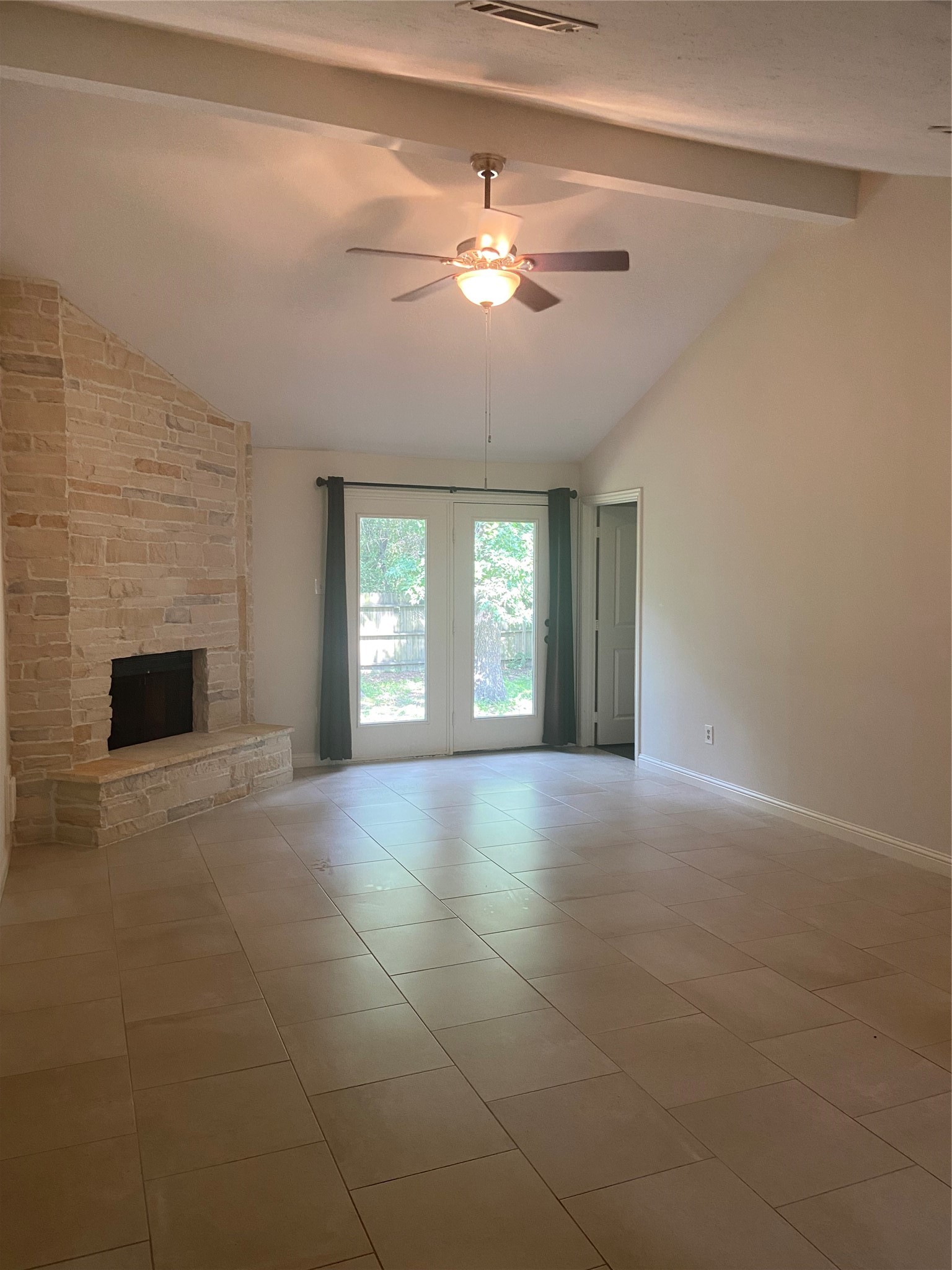 60 Oldstream Court Spring, TX 77381 - Photo 4 of 9 a view of an empty room with chandelier fan and fire place