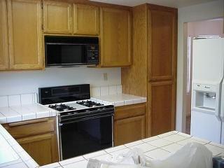 2019 Seville Street Santa Rosa, CA 95403 - Photo 4 of 6 a kitchen with stainless steel appliances a stove a microwave and a sink