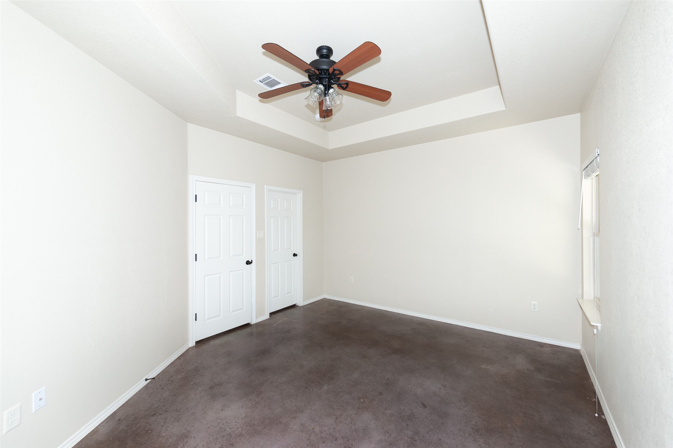 245 Joanne Loop, Unit B Buda, TX 78610 - Photo 23 of 33 Primary bedroom with ensuite full bathroom and walk in closet