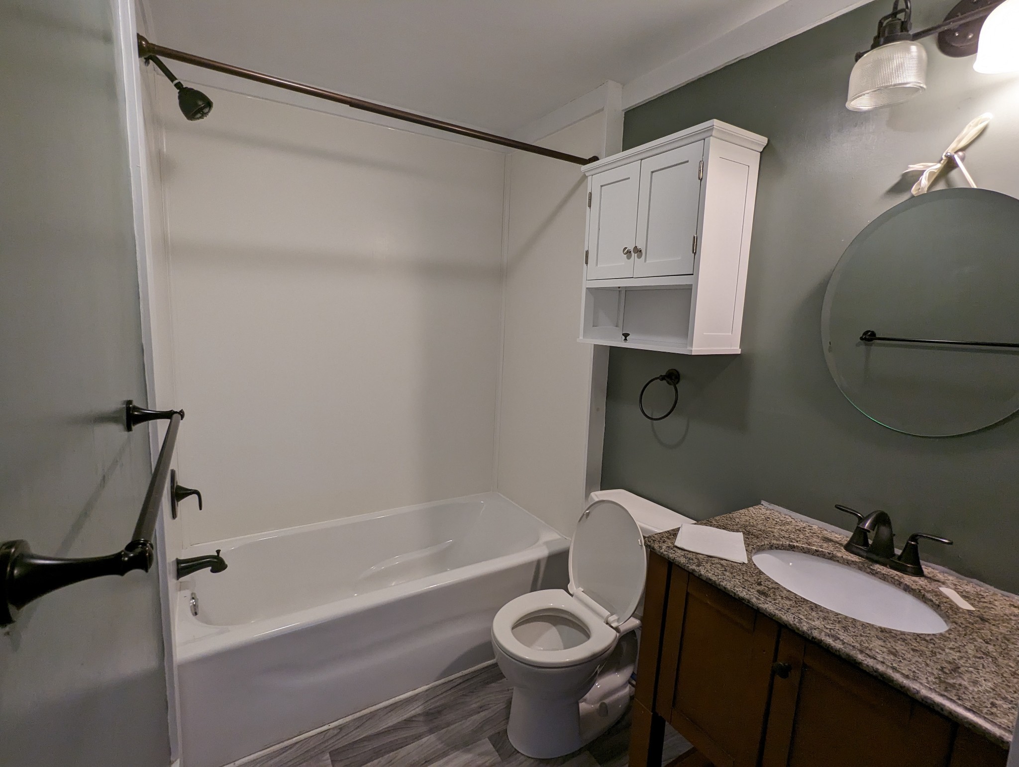 1097 Lower Lick Creek Road Linden, TN 37096 - Photo 12 of 45 a bathroom with a granite countertop sink toilet and shower