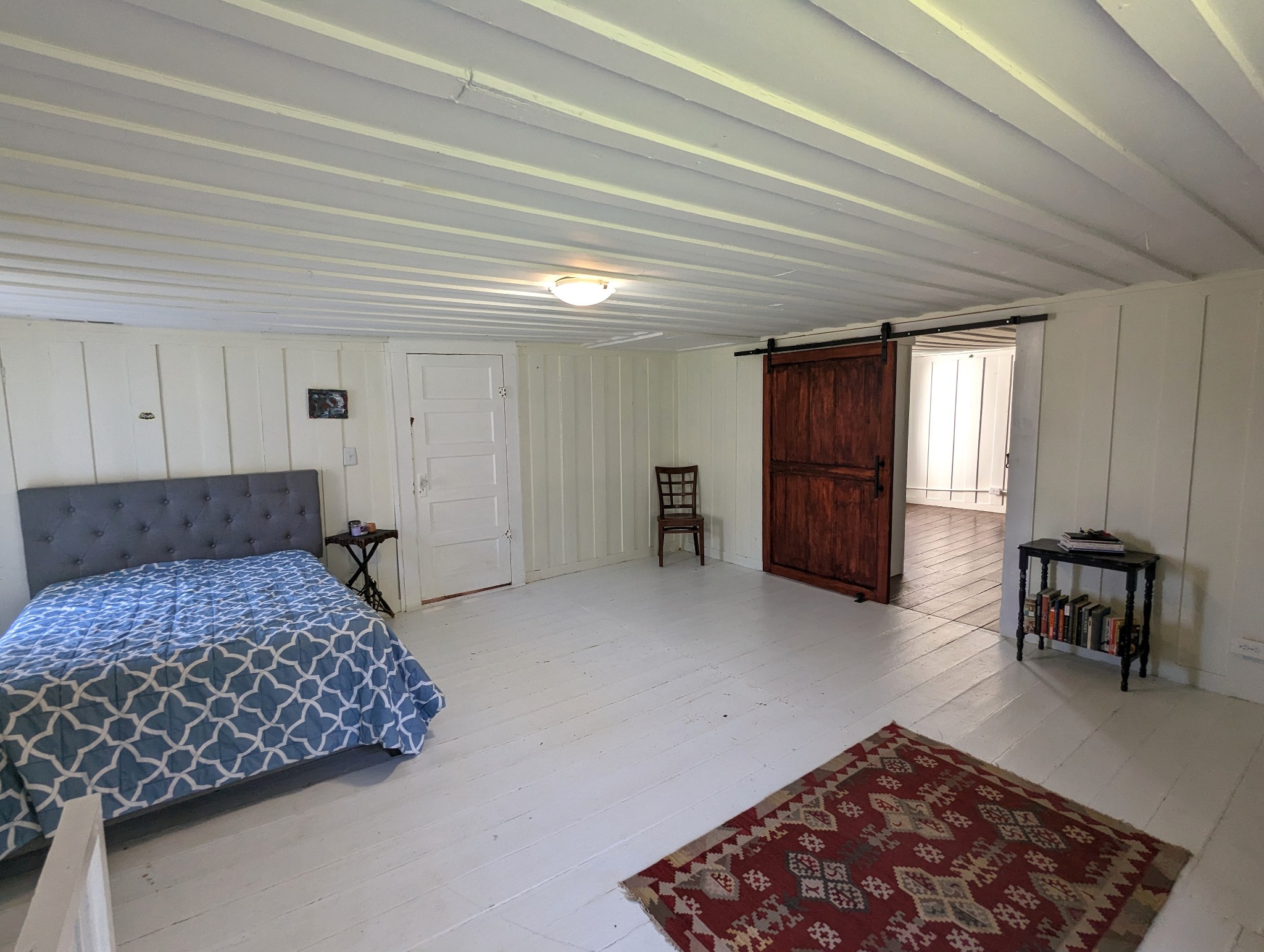 1097 Lower Lick Creek Road Linden, TN 37096 - Photo 19 of 45 a bedroom with a bed and furniture
