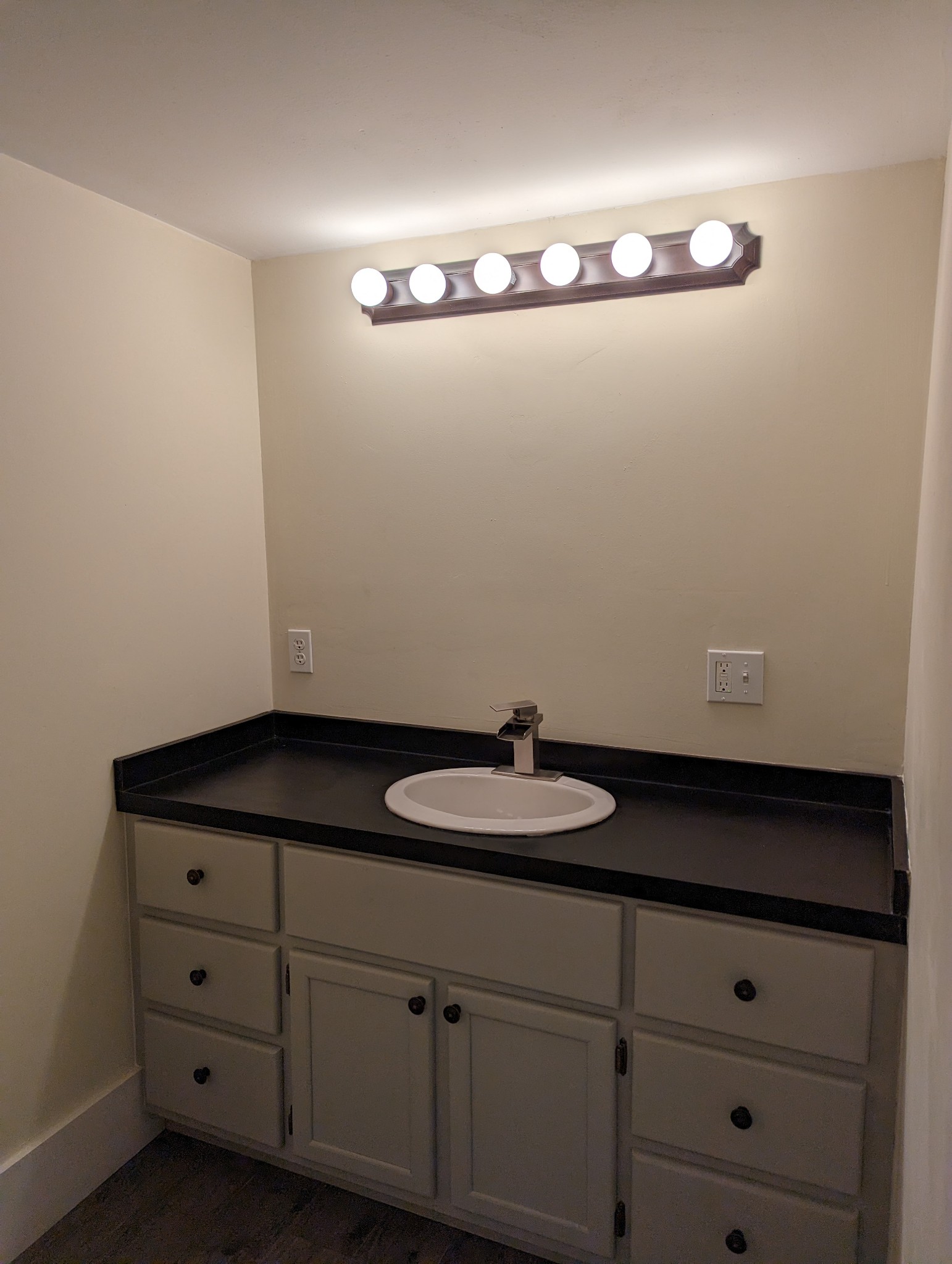 1097 Lower Lick Creek Road Linden, TN 37096 - Photo 24 of 45 a bathroom with a granite countertop sink and a mirror
