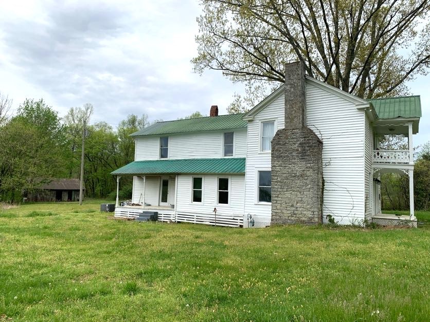 1097 Lower Lick Creek Road Linden, TN 37096 - Photo 3 of 45 a front view of house with yard and green space