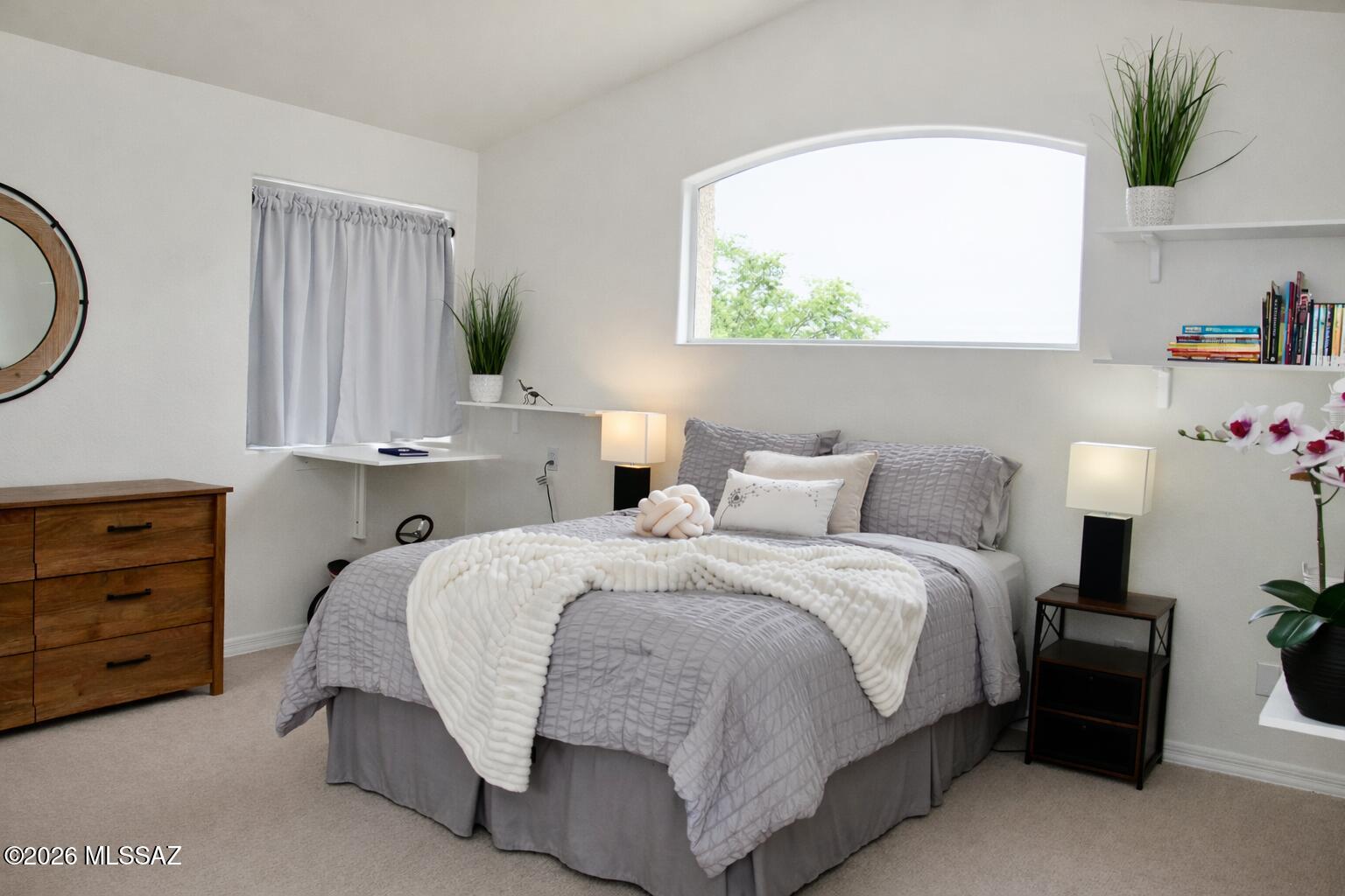 5202 Spring View Drive Tucson, AZ 85749 - Photo 23 of 49 a bedroom with a bed a mirror and window