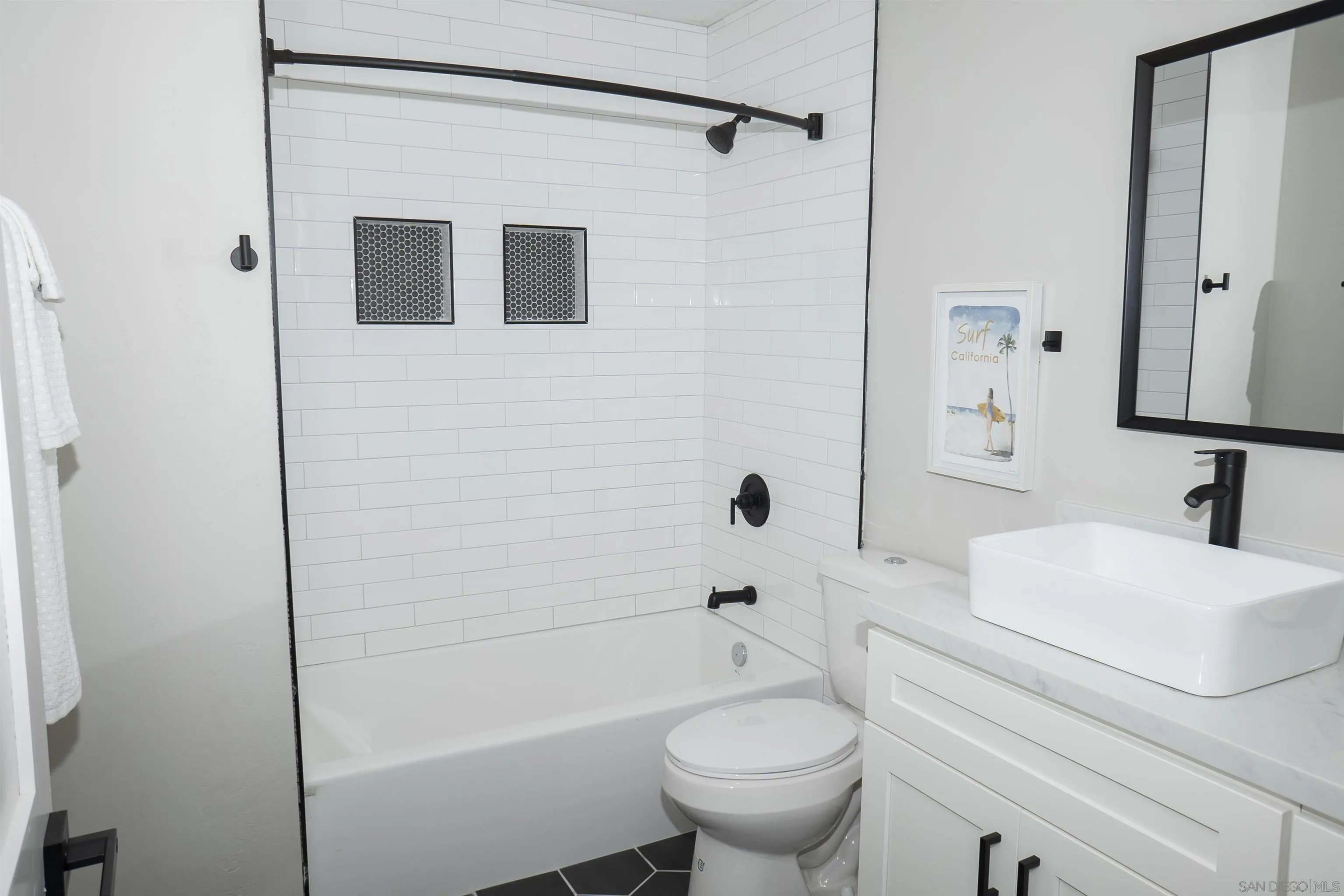 5548 Riley Street San Diego, CA 92110 - Photo 11 of 15 a bathroom with a sink toilet and shower