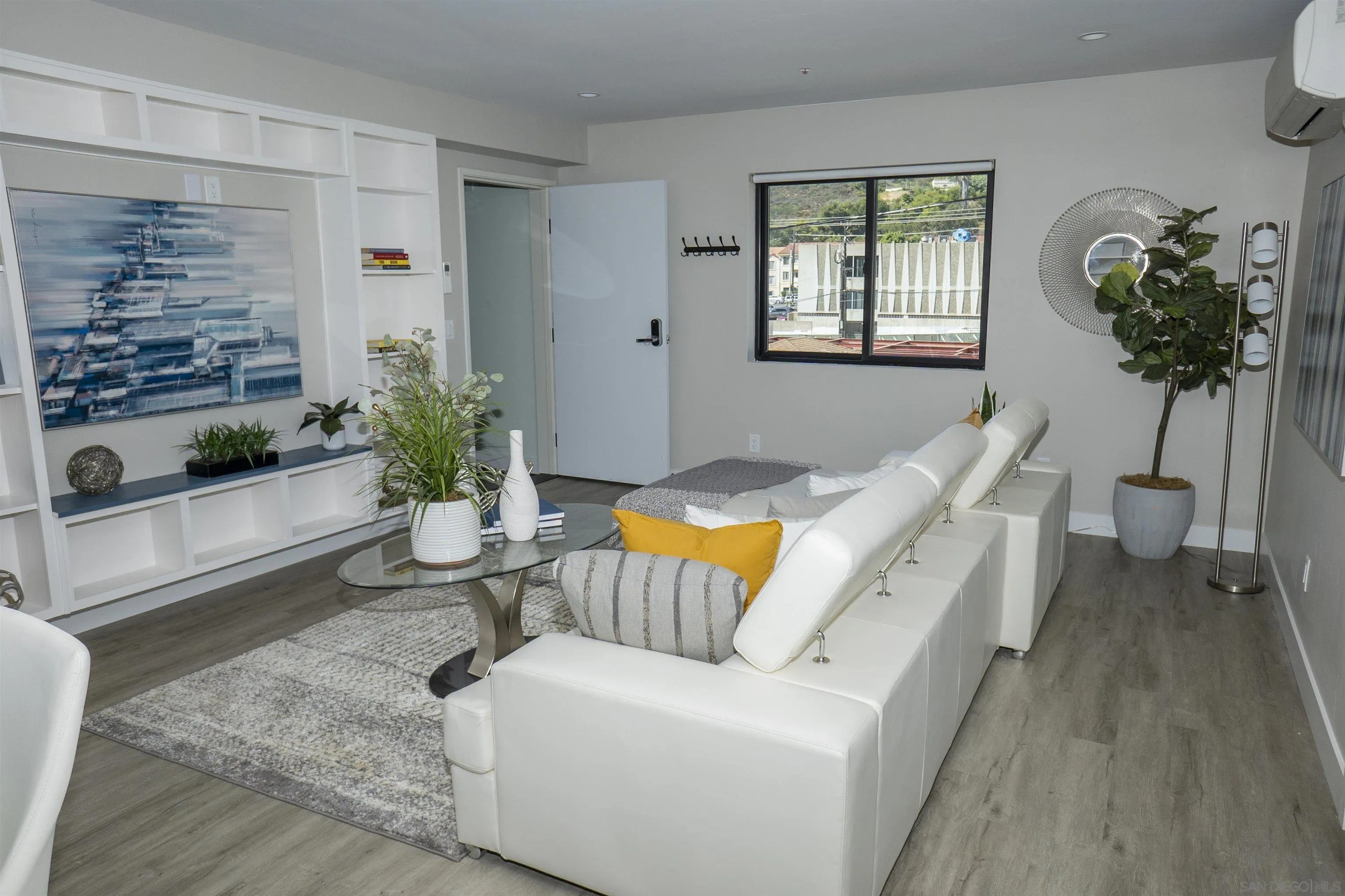 5548 Riley Street San Diego, CA 92110 - Photo 13 of 15 a living room with furniture and a potted plant