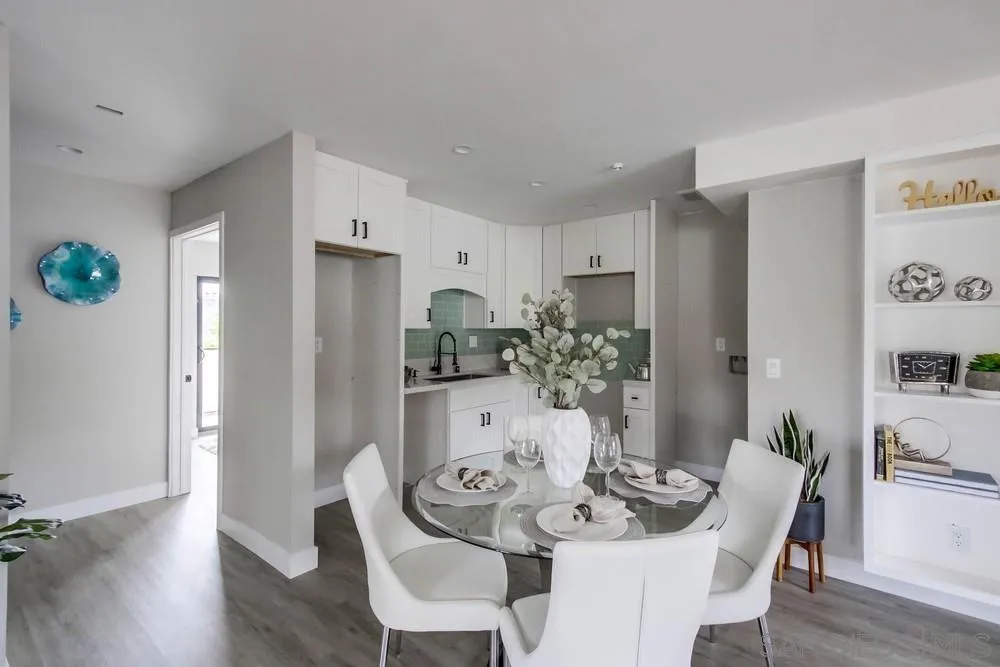 5548 Riley Street San Diego, CA 92110 - Photo 6 of 15 a view of a dining room with furniture and wooden floor
