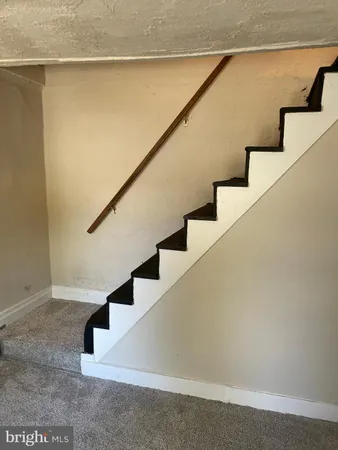 a room with a dresser and a window