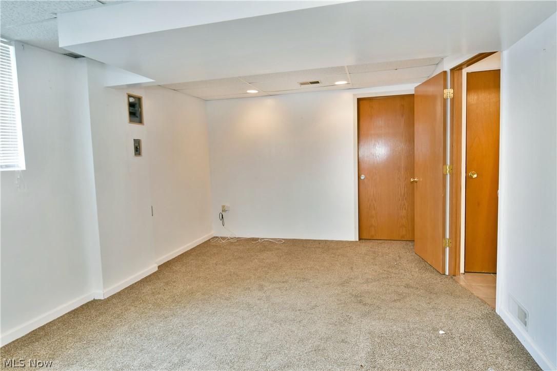 2470 North Road Southeast Warren, OH 44484 - Photo 35 of 35 Carpeted spare room featuring a textured ceiling