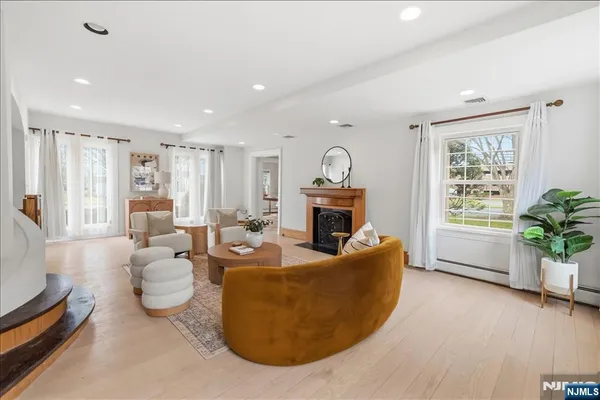 a living room with furniture and a fireplace