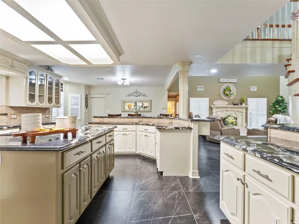 a kitchen with a sink stove and cabinets