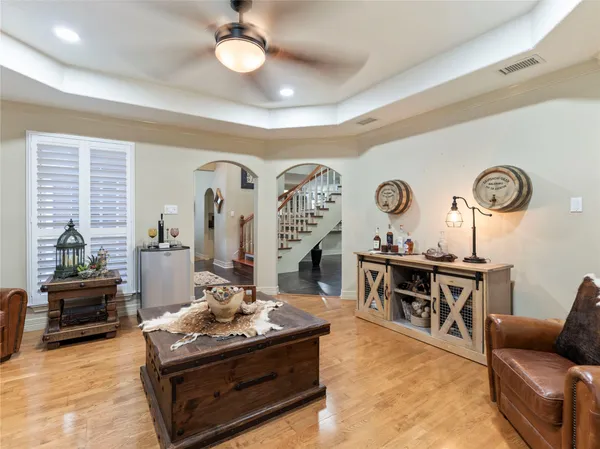 a living room with furniture and wooden floor