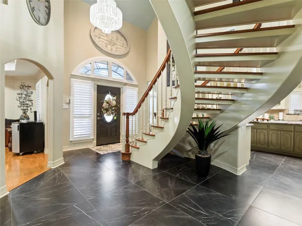 a view of an entryway with wooden floor