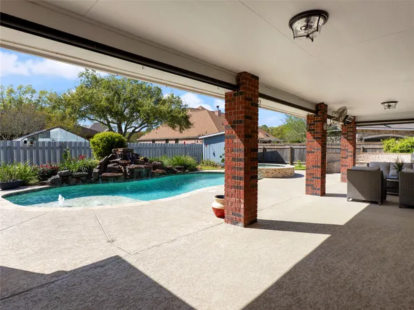 a view of a porch with seating space