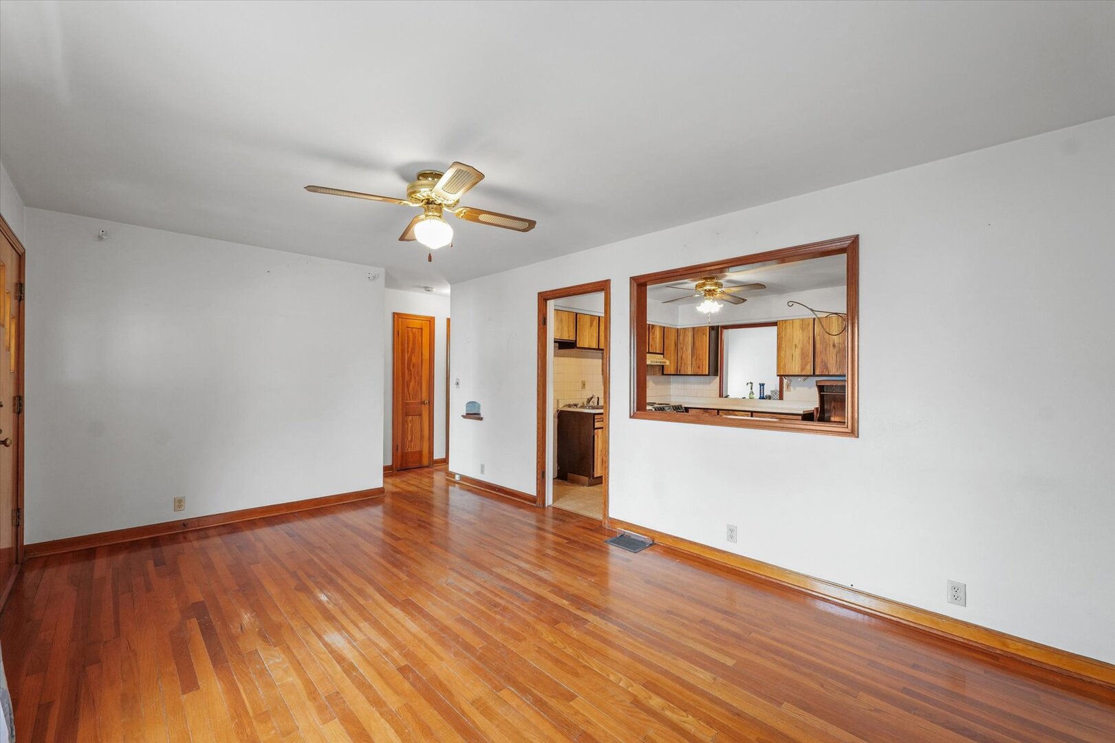 811 West Harvard Street Champaign, IL 61820 - Photo 11 of 34 a view of an empty room with window and wooden floor