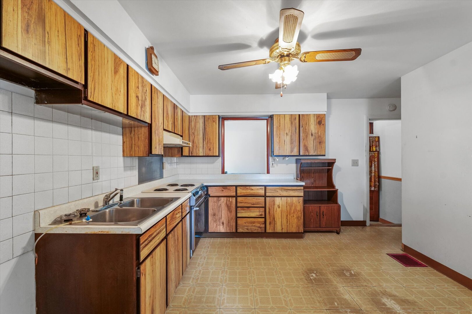 811 West Harvard Street Champaign, IL 61820 - Photo 12 of 34 a kitchen with stainless steel appliances granite countertop a sink a stove and refrigerator