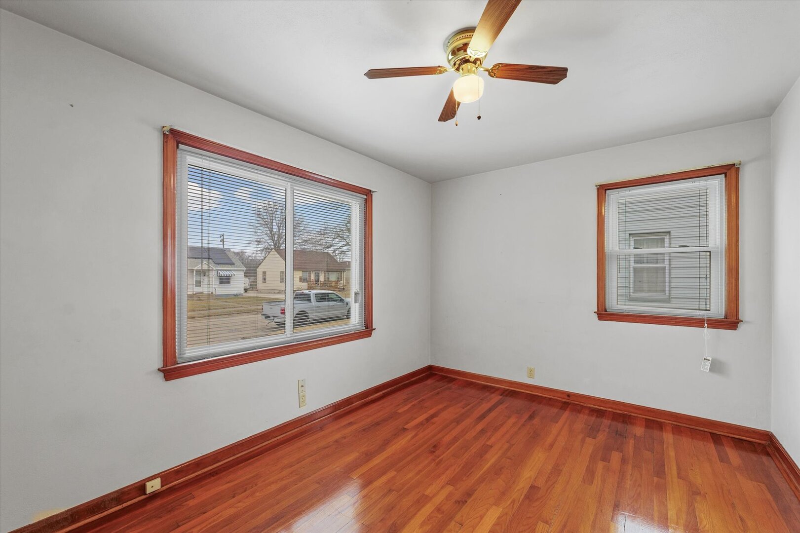 811 West Harvard Street Champaign, IL 61820 - Photo 18 of 34 a view of an empty room with window and wooden floor