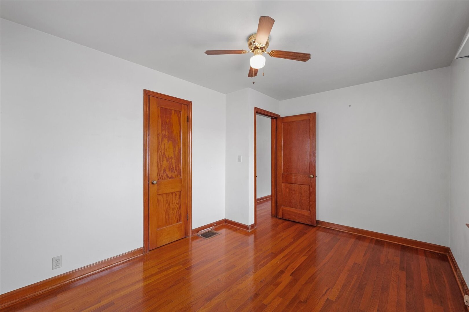 811 West Harvard Street Champaign, IL 61820 - Photo 19 of 34 wooden floor in an empty room with a window