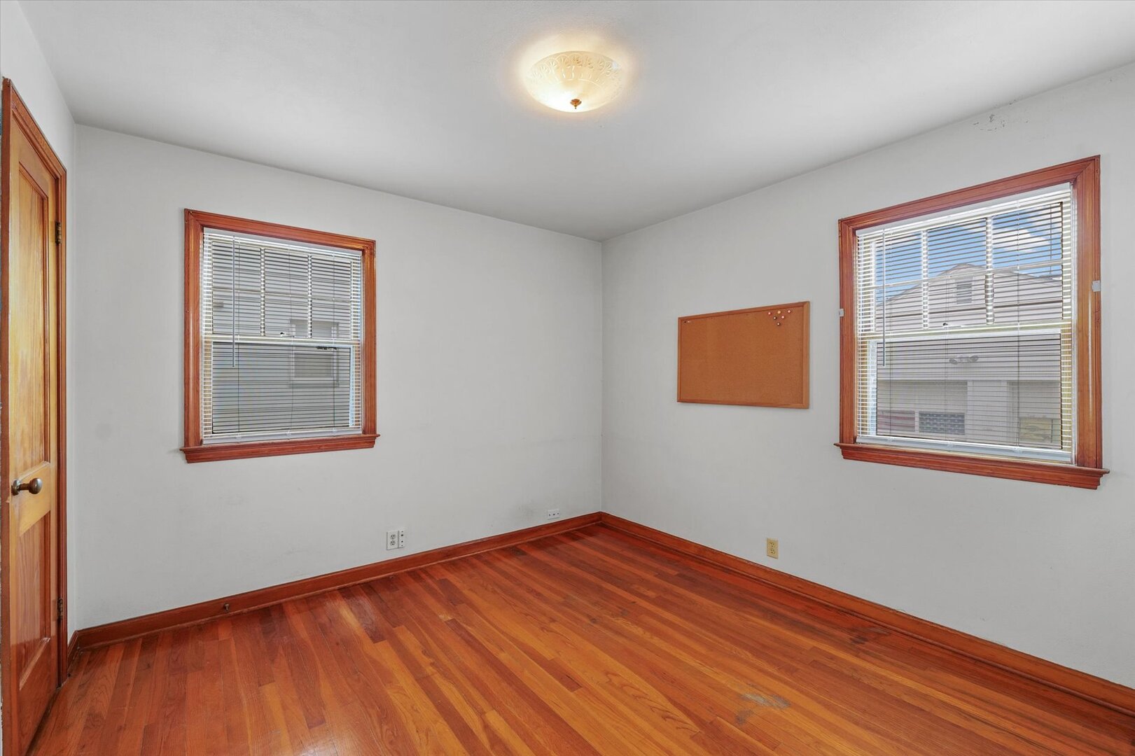 811 West Harvard Street Champaign, IL 61820 - Photo 20 of 34 a view of empty room with wooden floor and fan