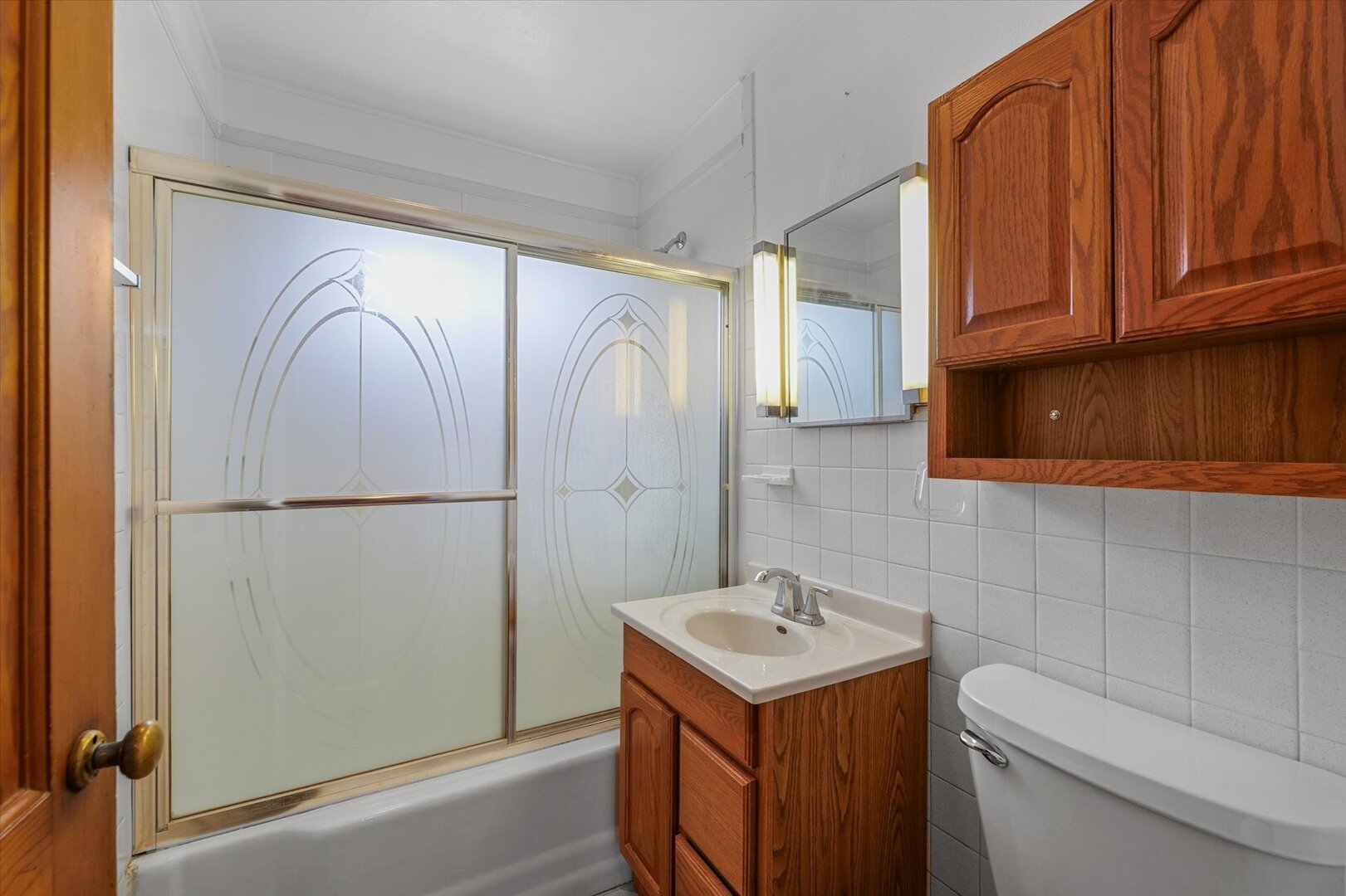 811 West Harvard Street Champaign, IL 61820 - Photo 22 of 34 a bathroom with a sink a toilet and shower