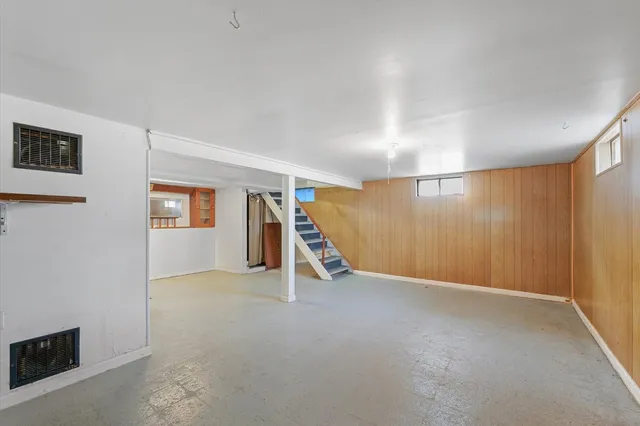 a view of an empty room with a fireplace