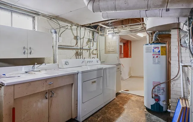a bathroom with a granite countertop sink a mirror a vanity and shower