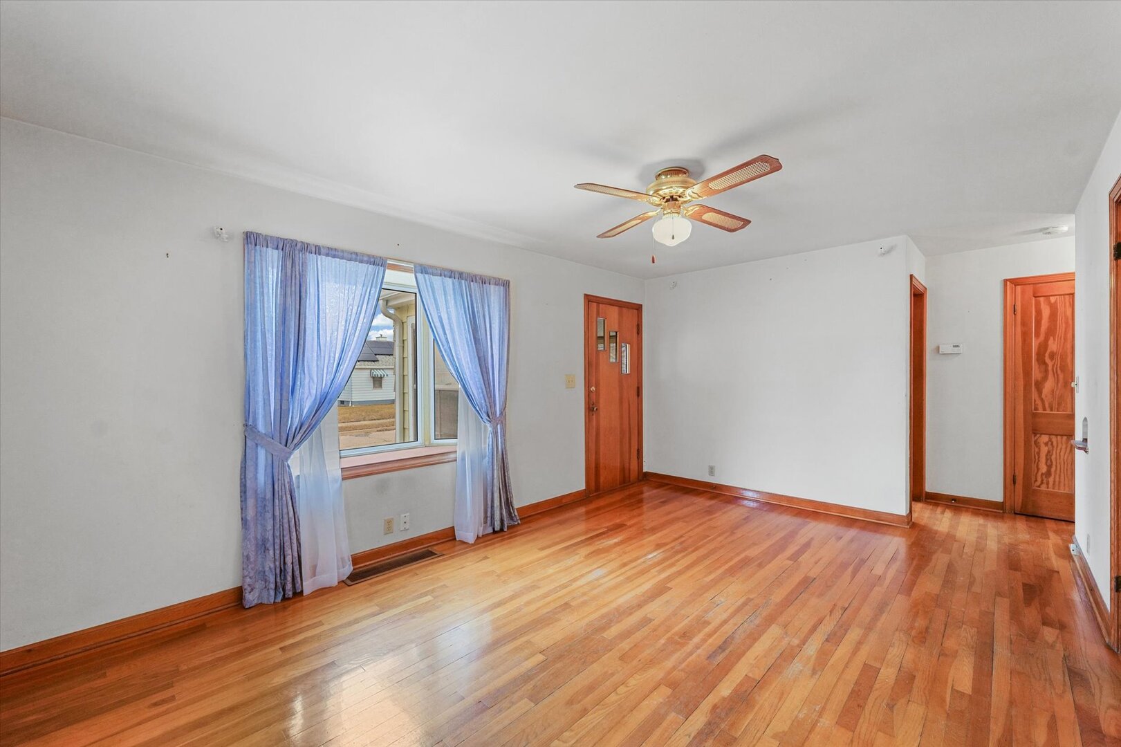 811 West Harvard Street Champaign, IL 61820 - Photo 10 of 34 wooden floor in an empty room with a window