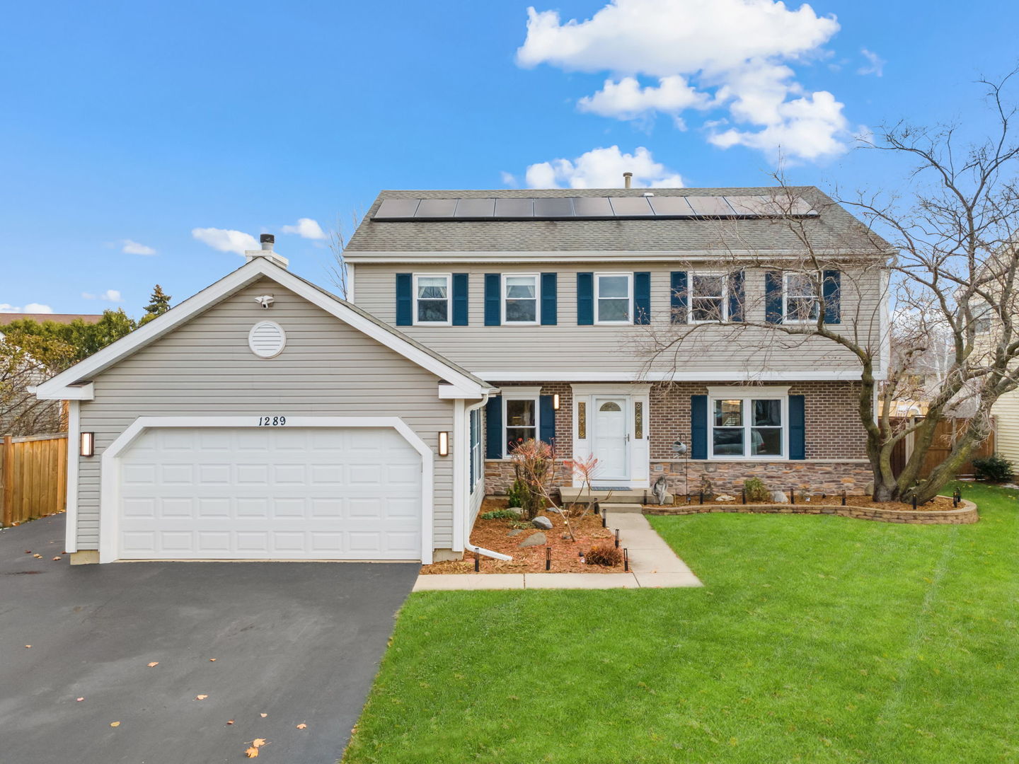 1289 Westport Ridge Crystal Lake, IL 60014 - Photo 1 of 27 a view of a house with a yard and pathway