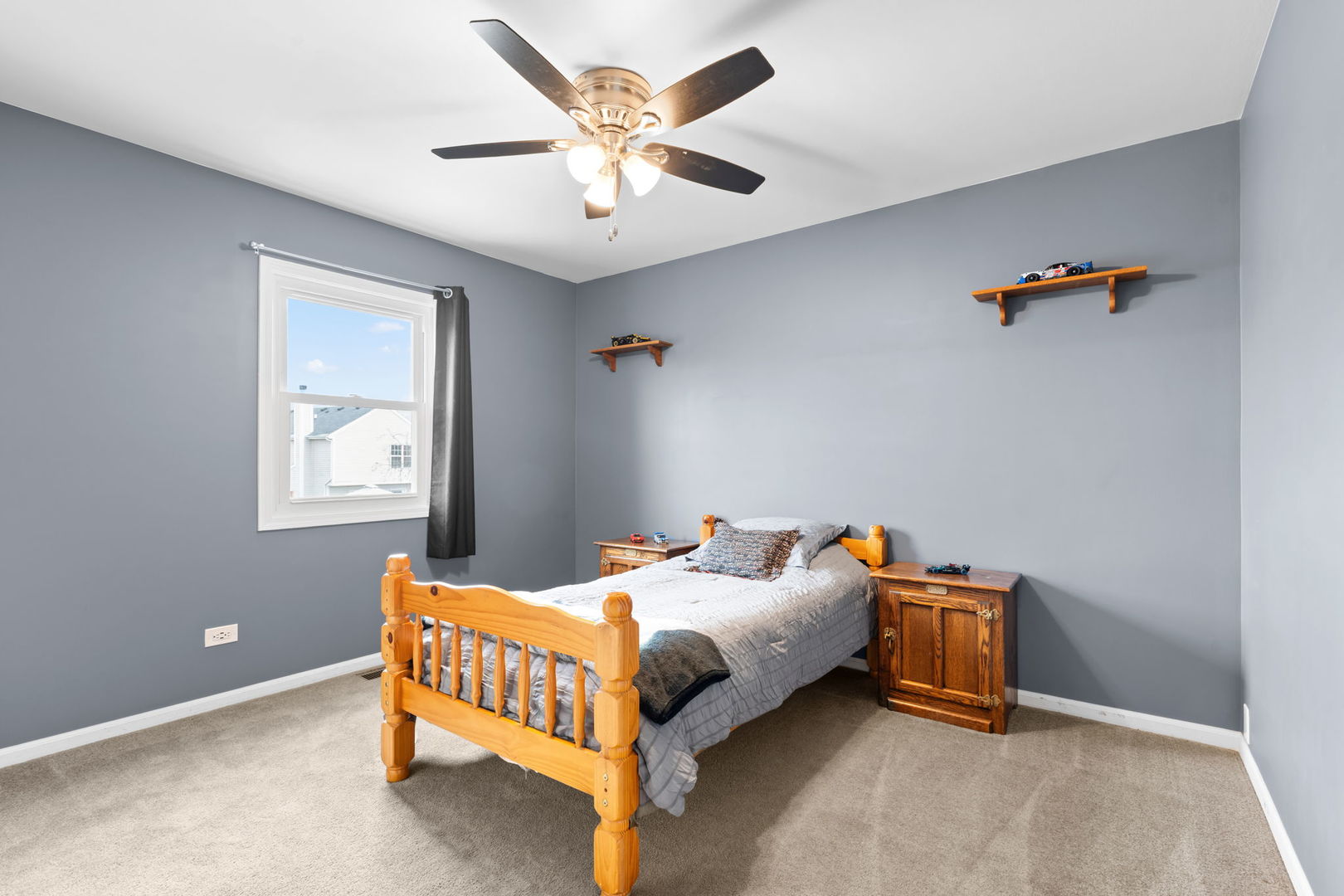 1289 Westport Ridge Crystal Lake, IL 60014 - Photo 15 of 27 a bedroom with a bed and a chandelier