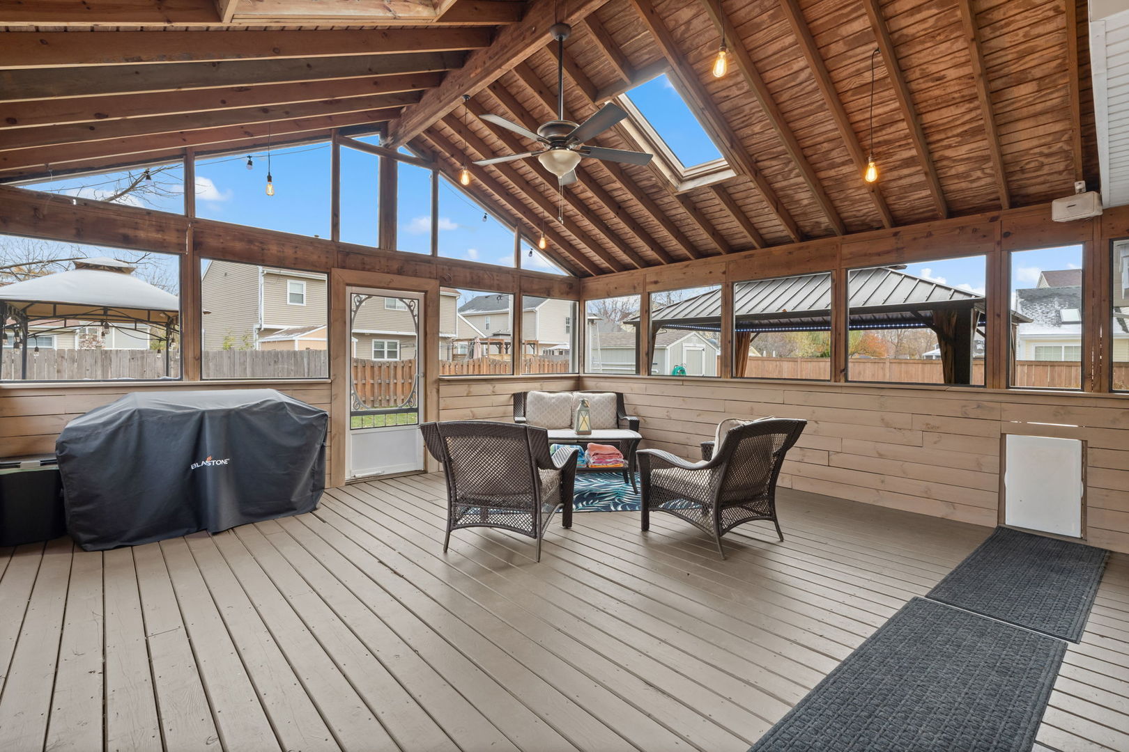1289 Westport Ridge Crystal Lake, IL 60014 - Photo 18 of 27 a balcony with furniture and wooden floor