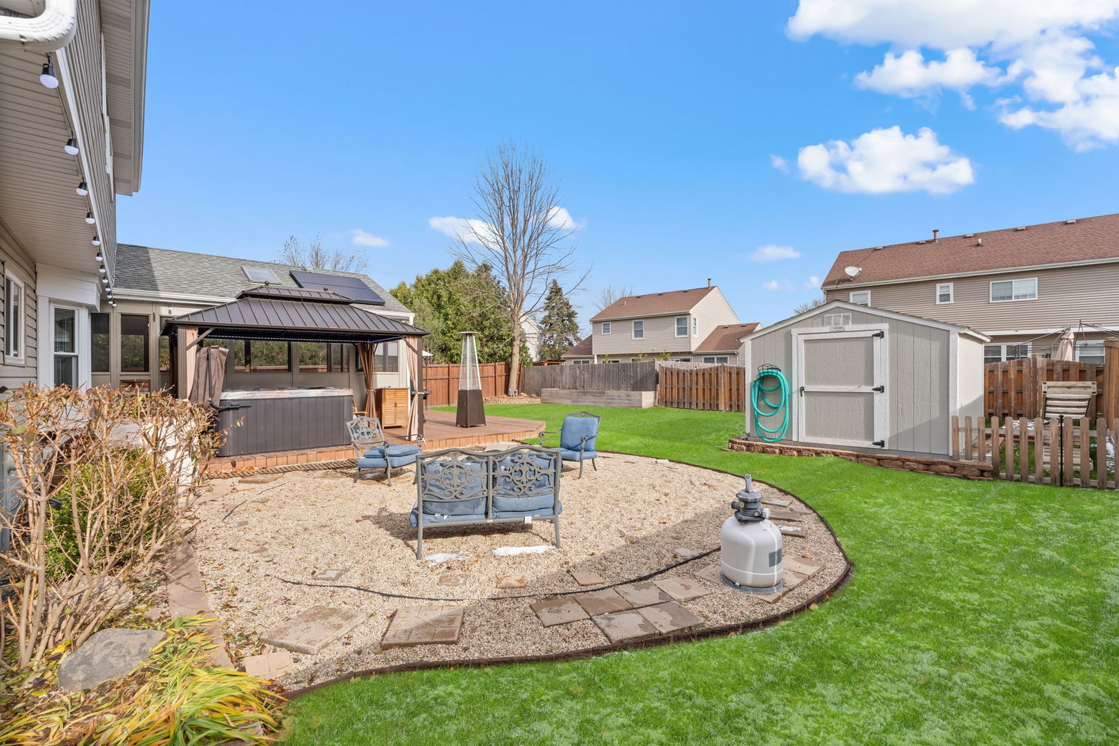 1289 Westport Ridge Crystal Lake, IL 60014 - Photo 20 of 27 a patio with a table and chairs and potted plants