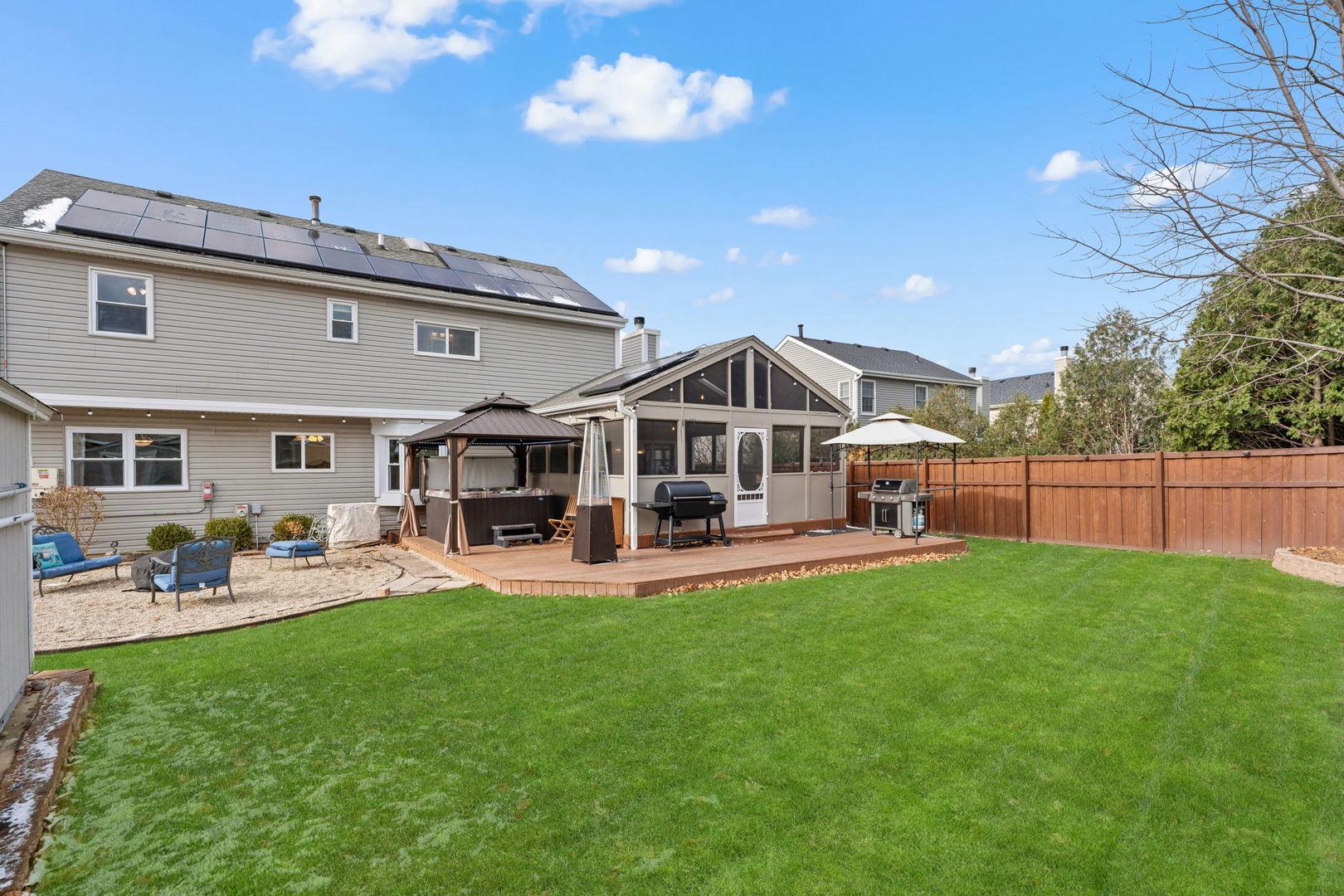 1289 Westport Ridge Crystal Lake, IL 60014 - Photo 22 of 27 a front view of a house with patio and garden