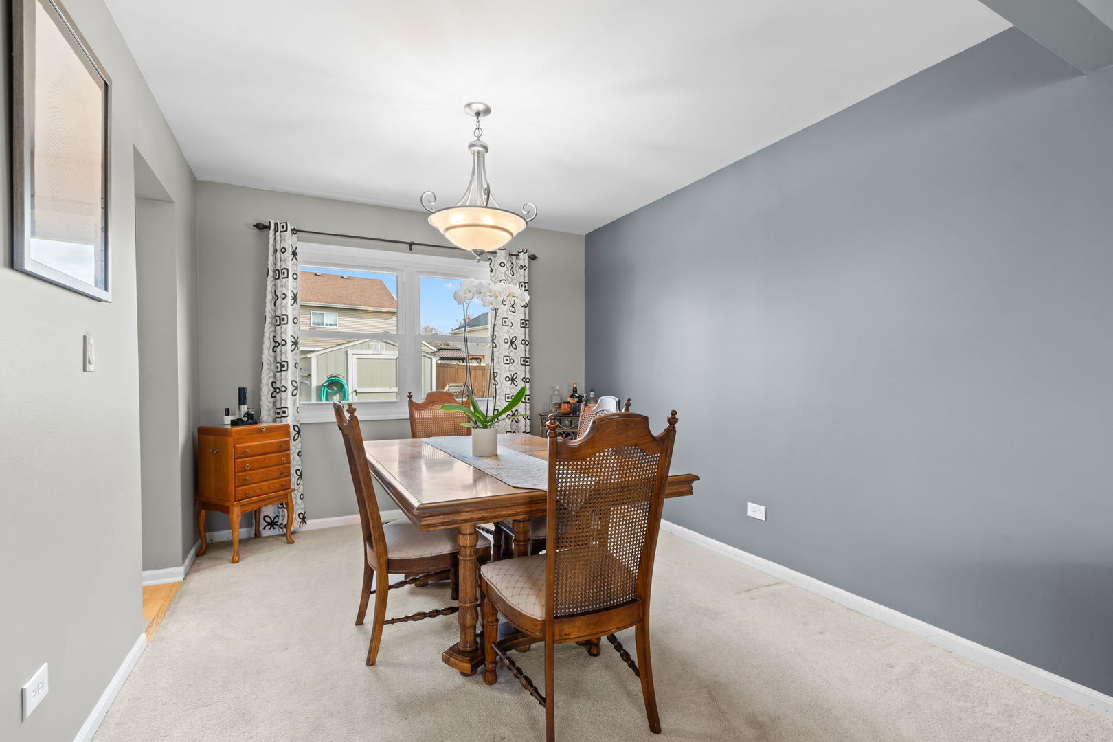 1289 Westport Ridge Crystal Lake, IL 60014 - Photo 7 of 27 a view of a dining room with furniture and a chandelier