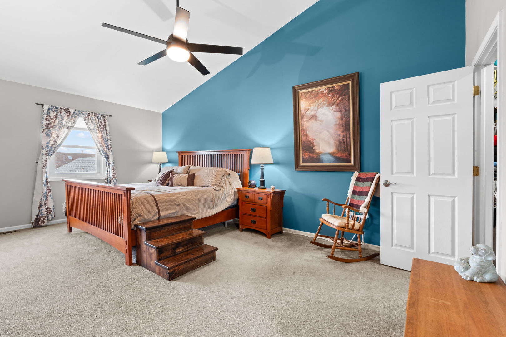 1289 Westport Ridge Crystal Lake, IL 60014 - Photo 10 of 27 a bedroom with bed and a chandelier