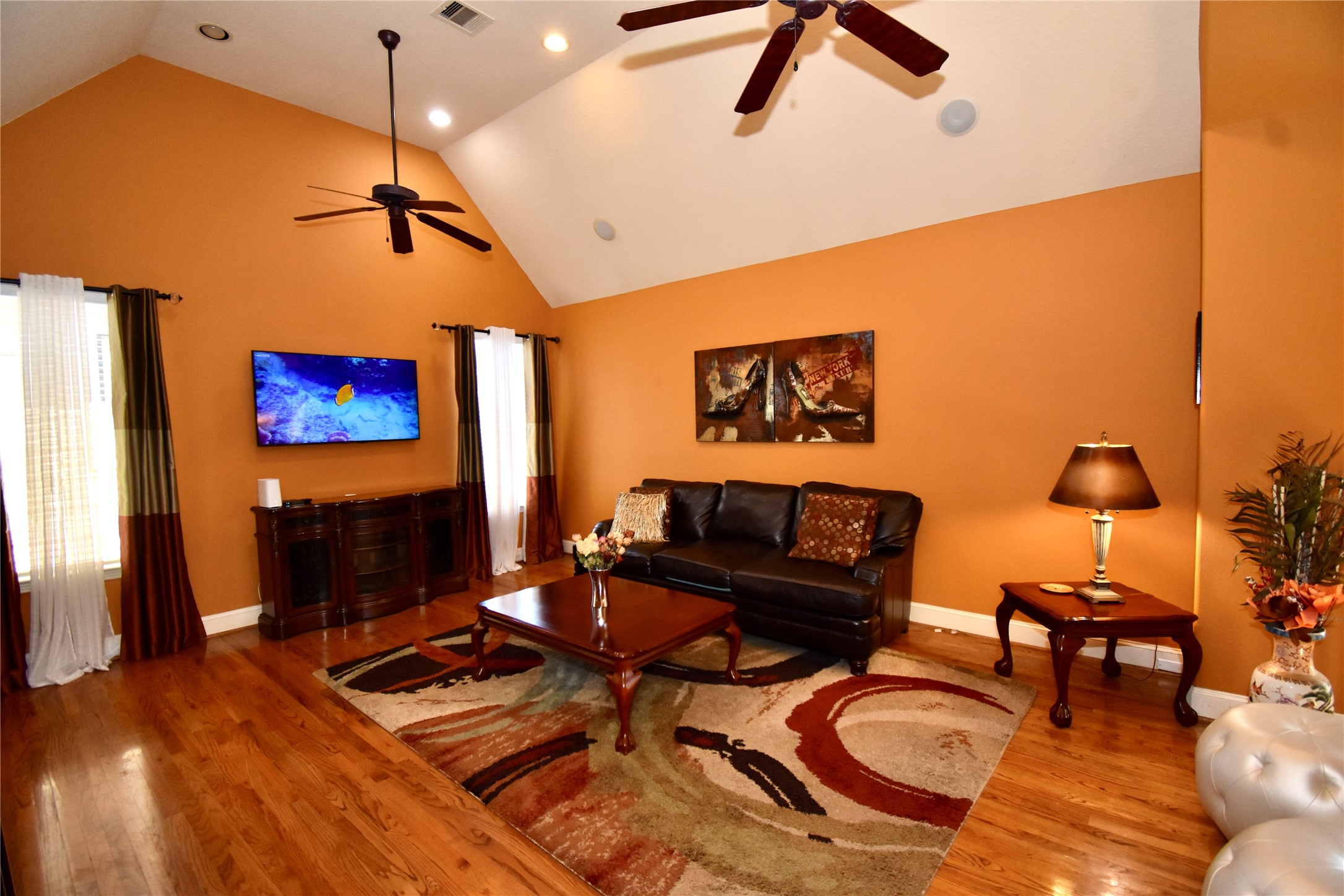 326 Gregg Street Houston, TX 77020 - Photo 6 of 26 a living room with furniture and a flat screen tv