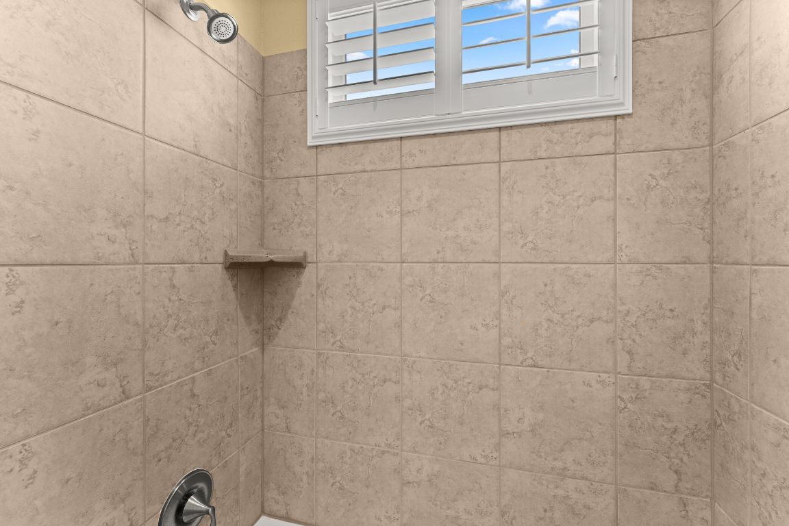 404 Amiata Avenue, Unit 34 Austin, TX 78734 - Photo 12 of 35 a bathroom with a shower
