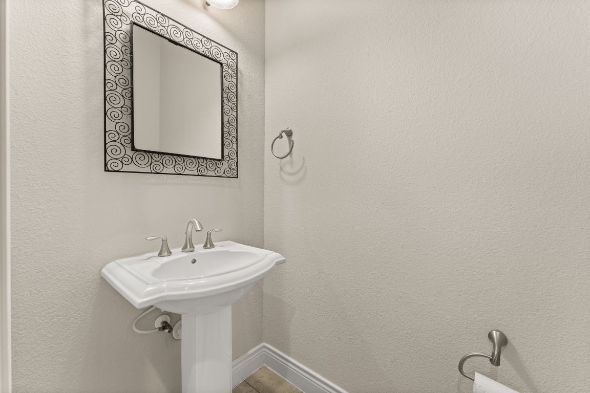 404 Amiata Avenue, Unit 34 Austin, TX 78734 - Photo 14 of 35 a bathroom with a sink a mirror and vanity