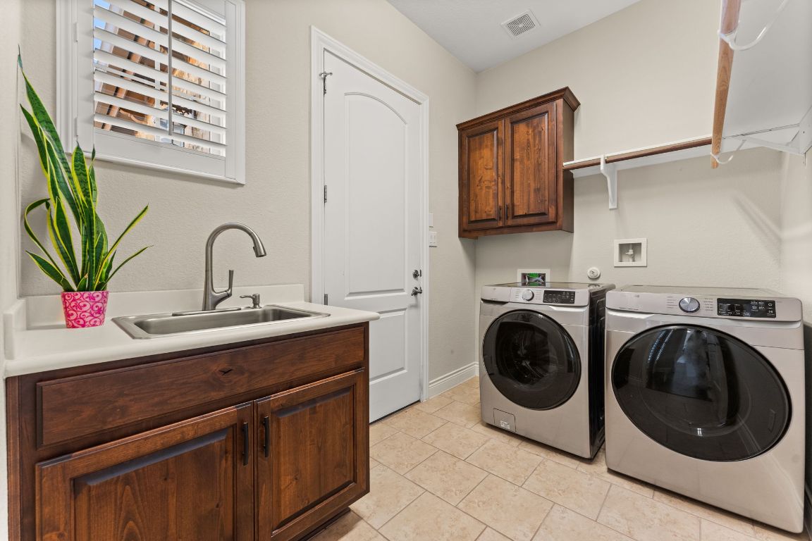 404 Amiata Avenue, Unit 34 Austin, TX 78734 - Photo 15 of 35 a utility room with sink dryer and washer
