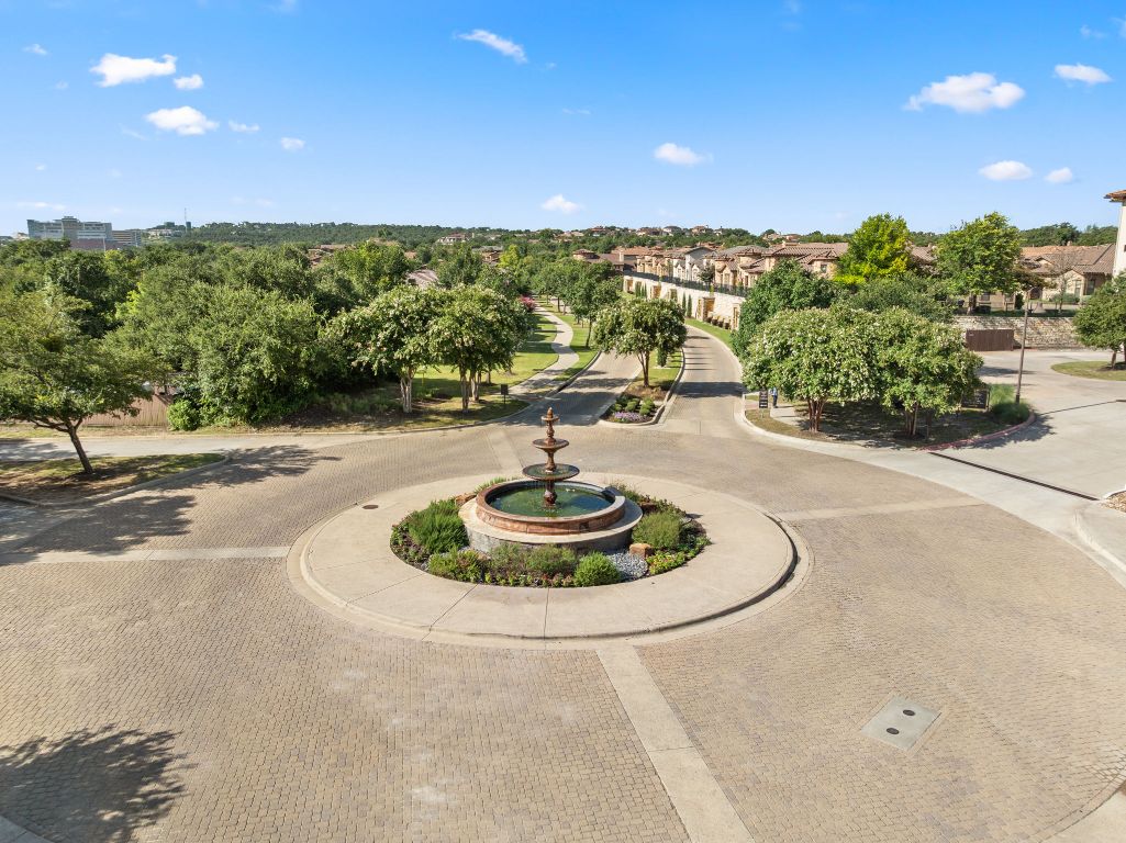 404 Amiata Avenue, Unit 34 Austin, TX 78734 - Photo 30 of 35 a view of a swimming pool with a yard and outdoor seating