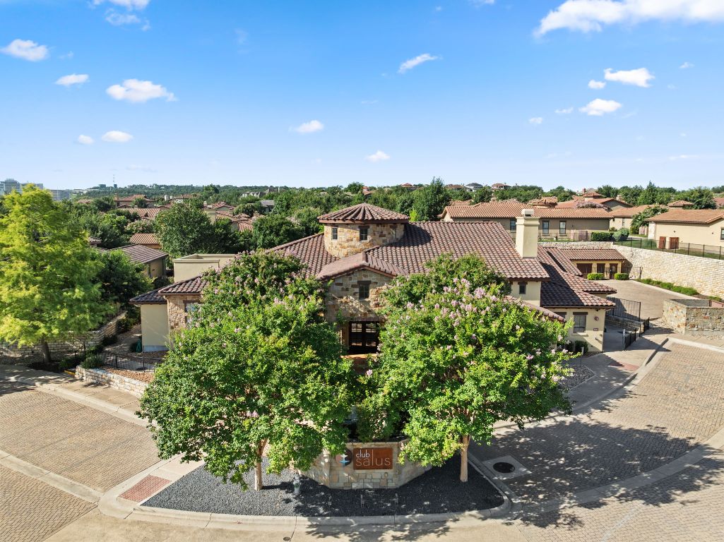 404 Amiata Avenue, Unit 34 Austin, TX 78734 - Photo 31 of 35 a view of a garden with a building in the background