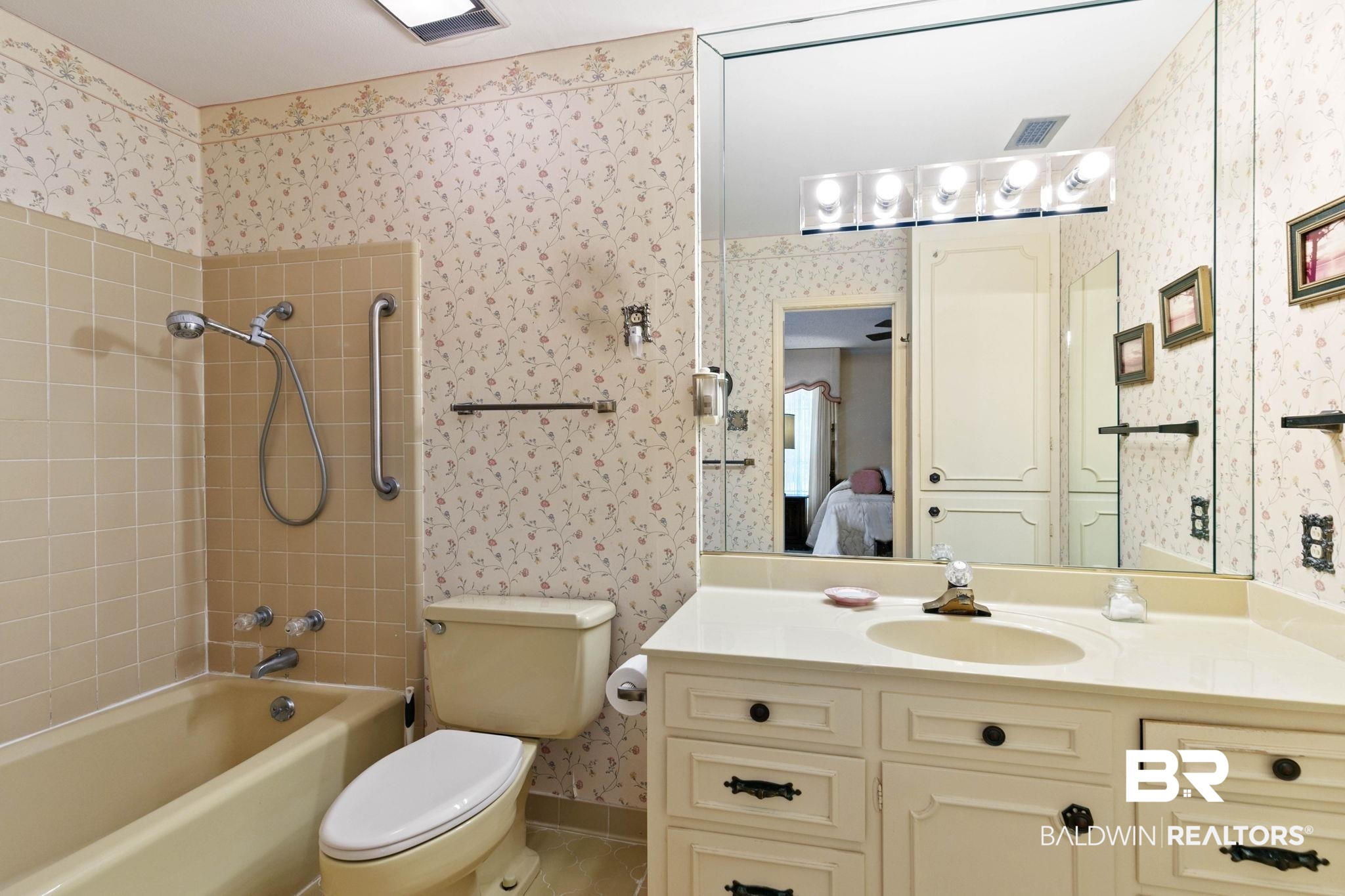 752 Evergreen Street Fairhope, AL 36532 - Photo 36 of 100 Bathroom featuring wallpapered walls, vanity, ensuite bath, washtub / shower combination, and light tile patterned floors